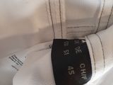 the back of a white shirt with a black label on it