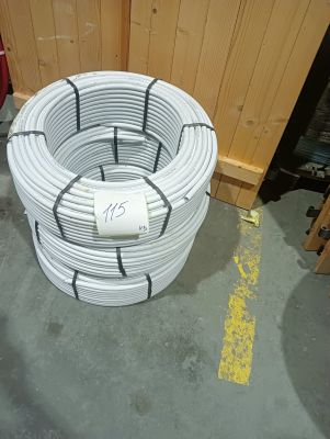 a coil of white wires on the floor in a room