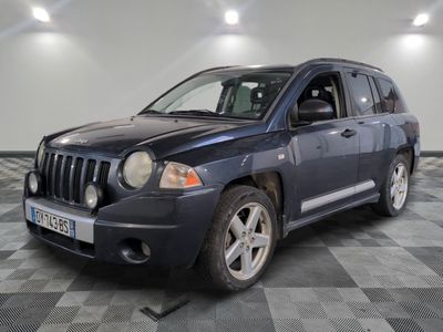 a picture of a blue jeep parked on a checkered floor