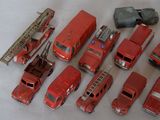 a lot of toy fire trucks that are on a table