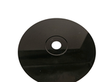 a black disc with a hole in the middle of it