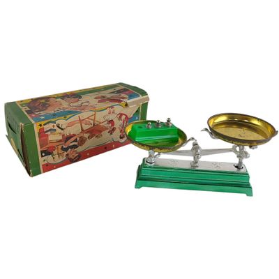 une image représentant une balance sur laquelle se trouve une boîte, avec une autre boîte posée dessus
