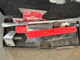 a tool case with tools in it sitting on the ground