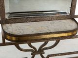 a mirror on a table with a marble tray on it