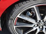 a close up of a tire on a red car