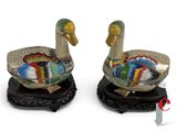 pair of colorfully painted ducks on wooden bases on a white background
