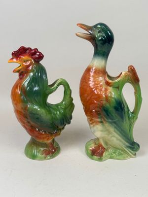 pair of ceramic figurines of a rooster and a rooster