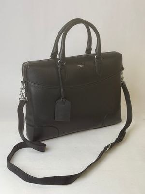 black leather briefcase with strap and tag on white background