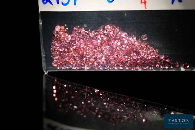 a box of pink glitter sitting on top of a table