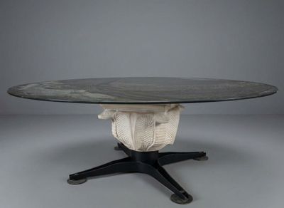 an image of a round table with a black top