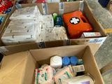 many boxes of supplies that are sitting on the floor