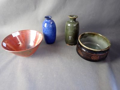 three bowls and a bowl sitting on a table