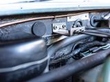a close up view of a car ' s engine with wires