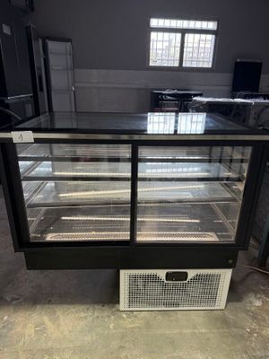 an image of a refrigerated display case in a warehouse