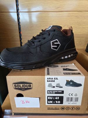 a pair of shoes that are on top of a box