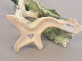porcelain figurine of a starfish and lettuce on a table