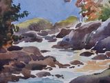watercolor painting of a river with rocks and trees in the foreground