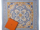 a blue and orange square scarf with an orange box