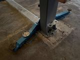 a person that is working on a machine in a garage