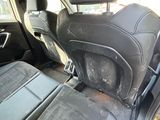 a dirty seat in the back of a car