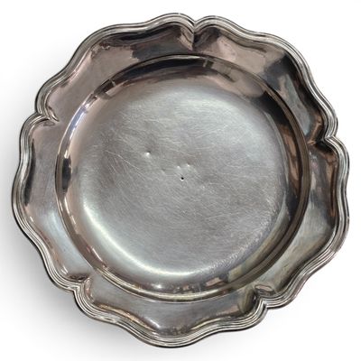 silver plate with scallop edge on a white background