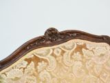 a close up of a chair with a white wall in the background