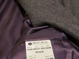 a label on the back of a purple jacket