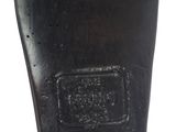 the bottom of a pair of black shoes on a white surface