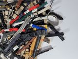 a pile of assorted electronic gadgets on a white surface