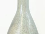 a glass vase that is sitting on a table