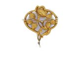 an image of a gold broochle with flowers and leaves
