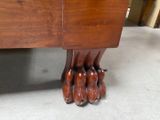 a close up of the feet of a wooden bed