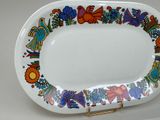 a white plate with a colorful design on it