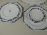 three plates with blue and white designs on them