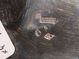a close up of a metal object with a tag on it
