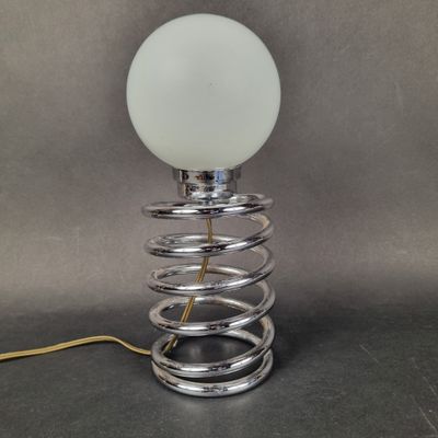 a close up of a lamp that is on a table
