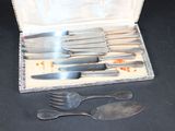 silverware in a silver case with spoons and forks