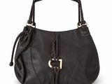 a close up of a black purse with a braid handle