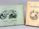 un vieux livre et un autre vieux livre posés sur une table