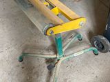 an image of a small table with wheels in a garage