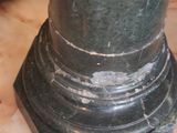 a close up of a marble pedestal with a clock on it