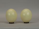 two eggs that are sitting on a table