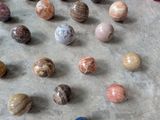 a lot of marbles that are on the floor