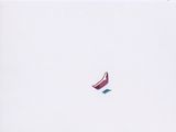 a kite that is flying in the sky on the beach