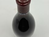 a bottle of wine that is sitting on a table