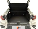 the back end of a white car with the trunk open