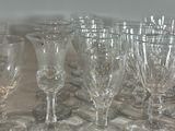 a lot of wine glasses sitting on a table