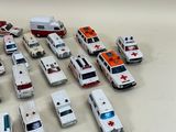 a lot of toy ambulances that are on the table