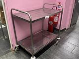 a small metal cart with a fire extinguisor on it