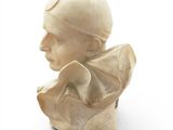 a bust of a man that is sitting on a table